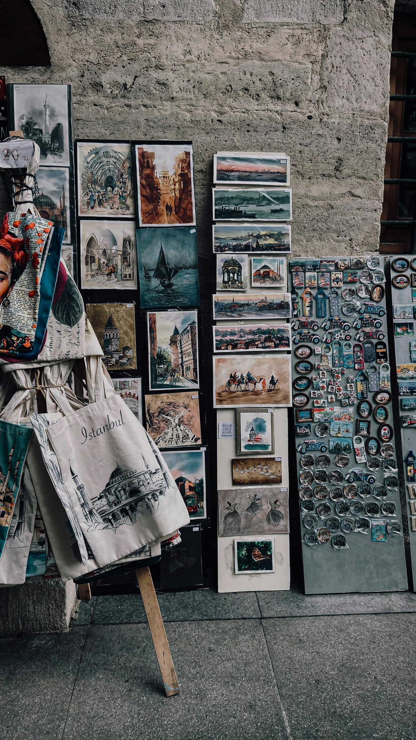 Colorful street art and souvenirs displayed in a vibrant Istanbul market setting.